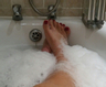 soapy legs and feet in the bath
