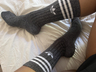 Feet in black sports socks