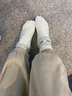 Tiny feet in white fluffy socks