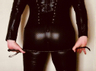 Ass in catsuit with whip