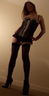 TS wearing basque, stockings and heels